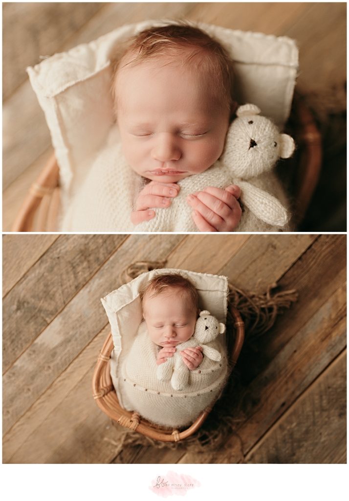 newborn baby boy wrapped in basket with teddy bear